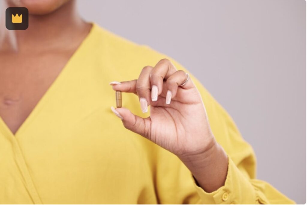 A LipNutrix capsule held between fingers